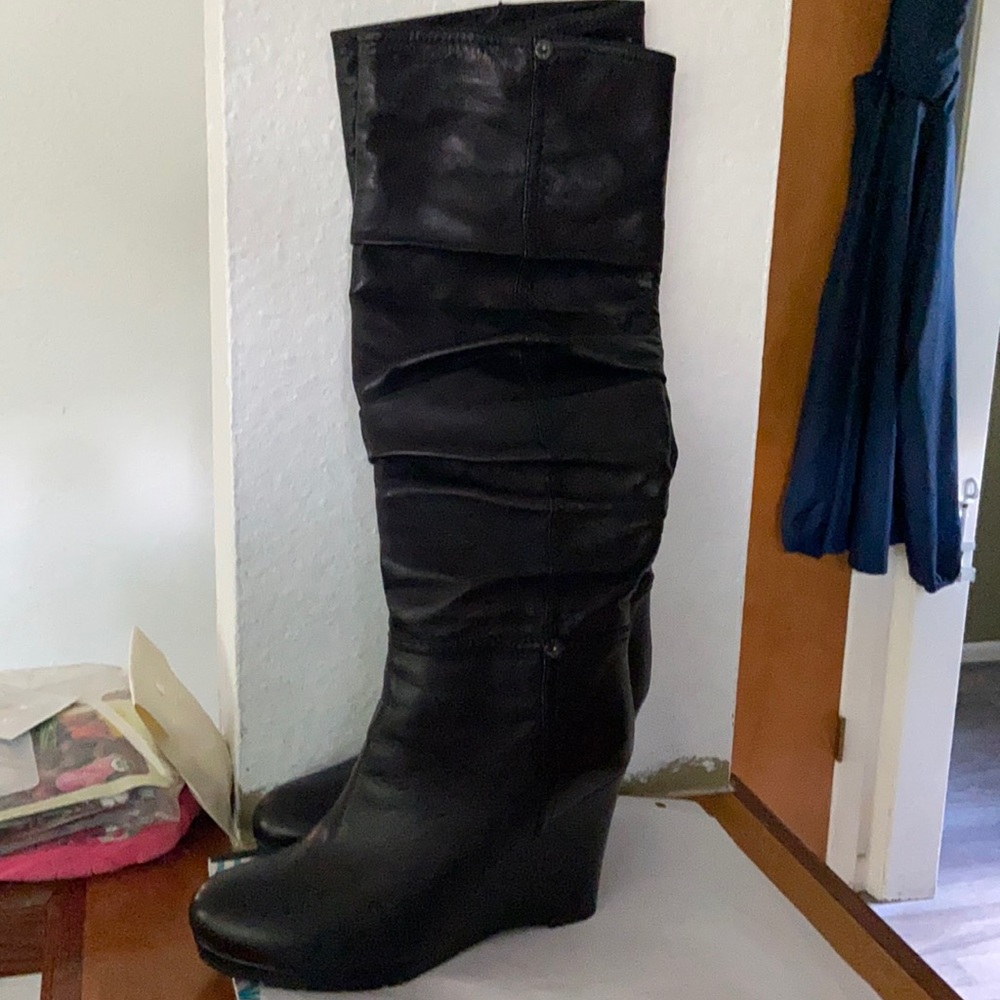 Black leather tall wedge boots